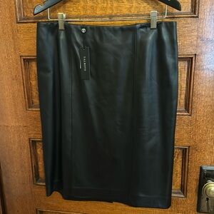 Gorgeous Black leather skirt brand new never worn. Straight cut and lined.